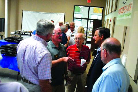 Enoch Autry/The Clayton Tribune. Standing with fellow Rotarians, Lee Penland (left) talks with Derek Dooley at the conclusion of the Rotary Club of Clayton’s June 19 meeting. Dooley, the club’s guest speaker, announced on Monday, Aug. 4, his intent to run as a Republican for U.S. Senate against Democratic incumbent Jon Ossoff. Dooley is a Clayton resident.