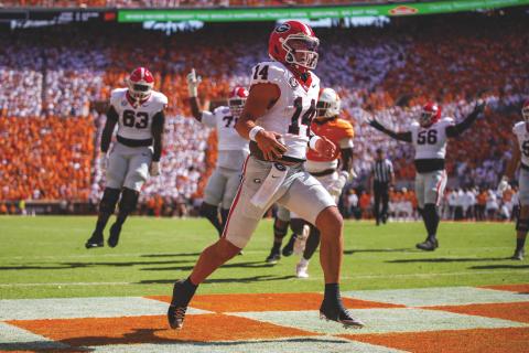Tony Walsh/UGAAA. Georgia quarterback Gunner Stockton runs into the end zone during Georgia’s 44-41 overtime win over Tennessee at Neyland Stadium in Knoxville, Tenn., on Sept. 13. Stockton also threw two TD passes.