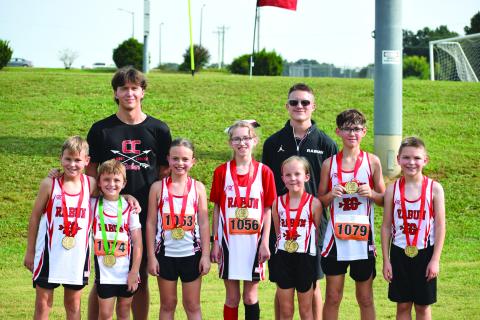 Submitted Photo. The Rabun County Recreation Department Cross Country had an incredible showing at Meet No. 3 at Lamar Murphy Park at Jefferson, Ga. The medalists included Keegan Hanifan-Wagner, Owen Moseley, Harper Westbrook, Madison Anderson, Opal Aker, Caiden Wood and Alden English. Also pictured are Assistant Coach CJ Augustine and Head Coach Ed Eidson. Not pictured is Nora Webb, who also medaled. Eidson said he is proud of this group for the hard work, grit, and pride they continue to show each week. 