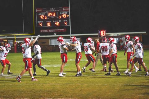 Wesley Branch/The Clayton Tribune. e Rabun County Wildcats claimed victory in a barn burner of a football game on the road at Dalton on Sept. 5. RCHS moved to 3-0 on the season with the 49-42 triumph. Here, Wildcat players celebrate with just 24.3 seconds remaining after senior Lake Evans intercepted a Dalton pass to secure the win. The Wildcats will be at Bremen on Friday, Sept. 12
