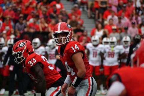 Wesley Branch/The Clayton Tribune. Former RCHS and current UGA quarterback Gunner Stockton prepares to take a snap versus Austin Peay on Sept. 6. 