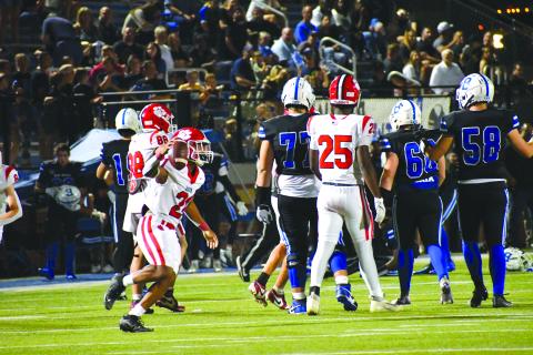 Wesley Branch/The Clayton Tribune. Rabun County senior defensive back Shaun Fruster (left) celebrates after intercepting Bremen quarterback Eli Brock in Rabun County’s 14-3 win on Sept. 12. The 4-0 Wildcats face Banks County Friday.
