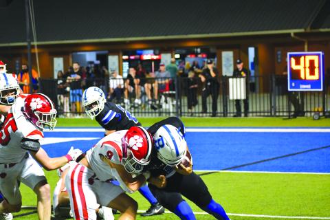 Wesley Branch/The Clayton Tribune. Rabun County sophomore linebacker Brock Brady and Bremen quarterback Eli Brock collide on a running play in the Wildcats’ 14-3 victory. 