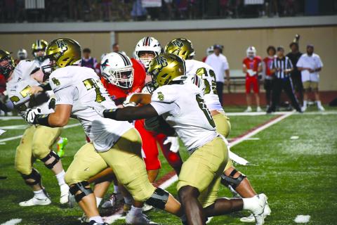 Wesley Branch/The Clayton Tribune. Rabun Gap sophomore running back Royce Djouguem navigates through Providence Day’s defense during the Eagles’ game versus the Chargers on Sept. 19. Djouguem scored his first touchdown of the season in the 55-34 loss. 