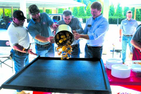 Enoch Autry/The Clayton Tribune. Rabun County Sheriff Mark Gerrills, State Sen. Bo Hatchett, U.S. Congressman Andrew Clyde and State Sen. Blake Tillery, who is running for lieutenant governor pour a pot of low country boil onto a table for the Sept. 13 meal to begin at the Civic Center Pavilions at 201 West Savannah St., Clayton. Republicans seeking seats in the 2026 election spoke to the 9th District gathering on Saturday evening.