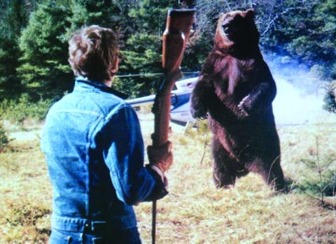 Submitted Photo. Andrew Prine battles the bear on the movie scene of “Grizzly” that was filmed in Clayton. The 1976 film will be shown at the Highlands-Cashiers Film Festival on Saturday, Sept. 20.