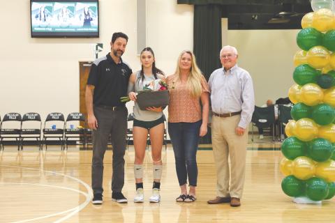 Wesley Branch/The Clayton Tribune. Tallulah Falls volleyball senior Becca Heyl (left center) and her father and head coach Matt Heyl (far left) on Senior Night, accompanied by Becca’s mother Coral Hulsey and President & Head of School for TFS, Dr. Larry Peevy. The Lady Indians finished the regular season 24-8, securing their third region title in program history.
