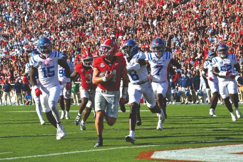 Wesley Branch/The Clayton Tribune. Current Georgia and former Rabun County quarterback Gunner Stockton strolls into the end zone for a rushing touchdown versus Ole Miss in the Bulldogs’ 43-35 win over the Rebels on Oct. 18. Stockton accounted for five total touchdowns and 348 total yards en route to SEC Offensive Player of the Week honors. 