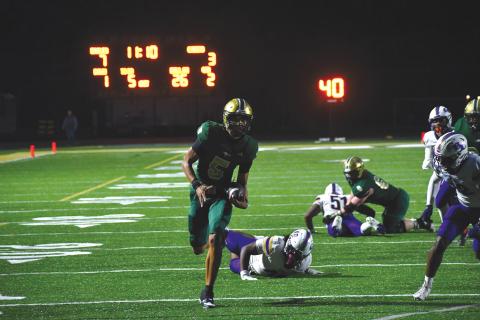 Wesley Branch/The Clayton Tribune. Rabun Gap senior quarterback Gavin Owens runs for a 26-yard touchdown versus Christian Brothers College on Oct. 3. Owens led the Eagles in rushing with 55 yards and threw for 330 yards in the loss. 