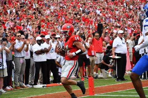 Wesley Branch/The Clayton Tribune. Georgia quarterback Gunner Stockton takes it into the end zone against Kentucky a touchdown run in the Bulldogs’ 35-14 win over Kentucky on Oct. 4. Former Rabun County standout whose high school No. 14 jersey has been retired, Stockton finished with three total touchdowns for UGA, including two rushing. 