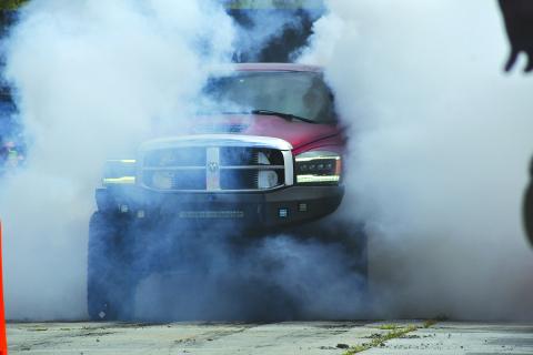 Enoch Autry/The Clayton Tribune. The Clayton Police Department hosted an event to get Christmas toys for underprivileged children and the Oct. 11 car show/burnout event was successful. Austin Shook’s Dodge Mega 3500 (above) was the first-ever burnout contest winner. See more on page A6.