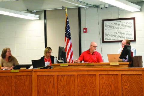 Enoch Autry/The Clayton Tribune. Clayton City Manager Trudy Crunkleton and Mayor Roy Quilliams look in the direction of City Attorney Mitch Baker during the Oct. 14 meeting at the Clayton City Hall. The Oct. 14 meeting was the first meeting with Quilliams as the city’s new mayor.