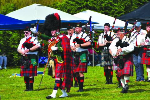 Enoch Autry/The Clayton Tribune. The Fraser Highlanders Pipe Band and with Col. Butch Teston performs Scottish music for the crowd at the Highlands Games on Sept. 27. 