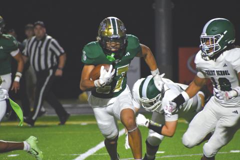 Wesley Branch/The Clayton Tribune. Rabun Gap sophomore defensive back Troy Dottin evades Christ School players after an interception in Rabun Gap’s 42-0 win over Christ School on Oct. 17. Dottin came away with his first interception of the season in the game. 