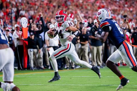 Conor Dillon/UGAAA. Current Georgia and former Rabun County quarterback Gunner Stockton runs versus Auburn in the Bulldogs’ 20-10 road win over the Tigers on Oct. 11. The win was the ninth-straight victory for Georgia over Auburn. 