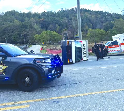 Photo courtesy Kinley Burtch. The U-Haul box truck reportedly driven by a female suspect from Dunwoody, Ga., is turned on its side in Mountain City after the driver was pursued law enforcement on Oct. 18. The pursuit started in Franklin, N.C.