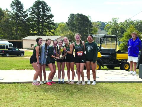 Submitted Photo. Tallulah Falls girls cross country members Olivia Henderson, Avery Keim, Naomi Russo, Mary Kate Ball, Eliza Culp, Meredith Orr and Emily Cai hold up their region championship trophy.