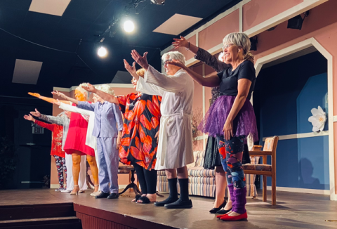 Submitted Photo. Dueling Elvises — David Spivey and Charles Lipthrott -- act out a scene. Behind them is Sara Jones, “director” of the senior living facility.