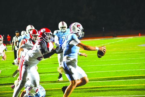 Wesley Branch/The Clayton Tribune. Rabun County defensive lineman Takeo Hibler brings down Providence Christian Academy quarterback Riley Braiden for Hibler’s first sack of the season in the Wildcats’ 62-21 win over the Storm. 