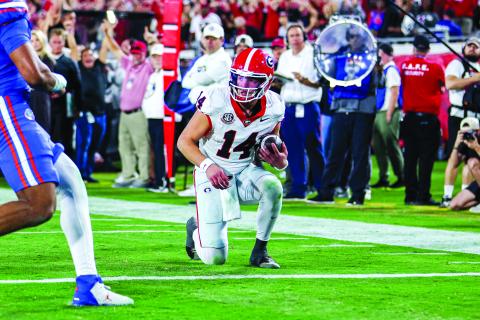 Conor Dillon/UGAAA. Current Georgia and former Rabun County quarterback Gunner Stockton takes a knee at the 1-yard line to clinch a 24-20 victory for the Bulldogs over their arch rival Florida Gators on Nov. 1. Georgia has beaten Florida five consecutive years, including this season. 