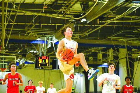 File Photo/The Clayton Tribune. Rabun County’s senior guard Huey Blalock goes in for a bucket. The RCHS boys are a state preseason No. 3.