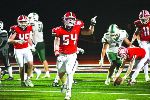 Enoch Autry/The Clayton Tribune.  Rabun County will host Dodge County in the first round of the state playoffs on Friday, Nov. 14, at Frank Snyder Memorial Stadium. Here junior defensive lineman Ryan Yearwood (54) celebrates after the Wildcats make a stop against Athens Academy at home on Oct. 24.