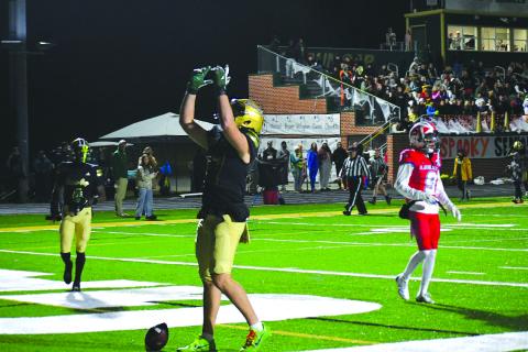 Enoch Autry/The Clayton Tribune. Rabun Gap sophomore tight end Cash Washburn points to the sky after catching a touchdown pass against visiting Legacy Sports Agency. 