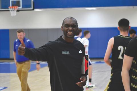 Wesley Branch/The Clayton Tribune. Rabun Gap head basketball coach Devin Liferidge gives a thumbs up following Rabun Gap’s season-opening win over Lanier Christian on Nov. 8 at Banks County High School. The Eagles defeated the Lighting 88-73, securing Liferidge’s first win at RGNS.