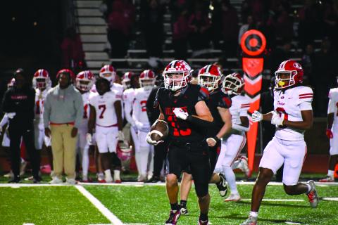 Wesley Branch/The Clayton Tribune. Rabun County senior Reid Giles returns an interception against Dodge County on Nov. 14 in the Wildcats’ 56-21 playoff win over the Indians. Rabun County hosts Berrien on Nov. 21 for the second round of the Class A Division I playoffs. 