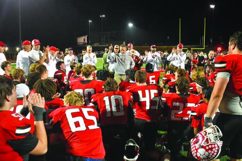 Enoch Autry/The Clayton Tribune. Coaches, support staff and Wildcat players applaud Rabun County head coach Rance Gillespie’s approval that RCHS is one of eight teams remaining in the Class A Division I playoffs. Gillespie said the team has embraced being “EL1TE” and now the Wildcats have reached the Elite Eight and will play after Thanksgiving.