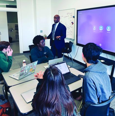 Submitted Photo. Rabun Gap-Nacoochee School teacher Dr. Mason West instructs his AP Economics class. West’s students will present their “Learner Snapshot” app to members of 1 Million Cups at a Dec. 10 meeting at the school.