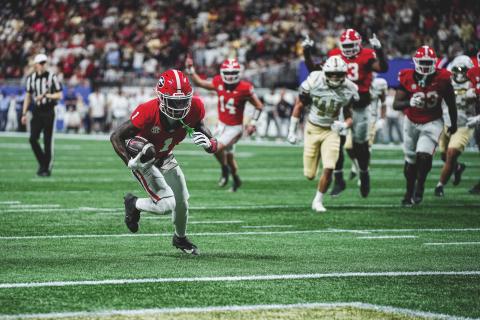 Tony Walsh/UGAAA. Georgia wide receiver Zachariah Branch runs to the end zone for a receiving touchdown in Georgia’s 16-9 win over Georgia Tech on Nov. 28. In the background is former Rabun County and current Georgia quarterback Gunner Stockton. Stockton and Branch connected for the only TD scored in the game. 