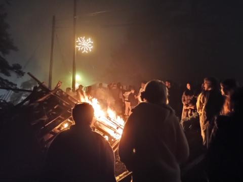 Megan Horn/The Clayton Tribune. Tallulah Falls community members and students at Tallulah Falls School kicked off the holiday season with its annual Town Christmas Party on Friday, Dec. 5. Unique to Tallulah Falls was a giant bonfire that lit up the night sky and warmed eventgoers on a chilly evening.