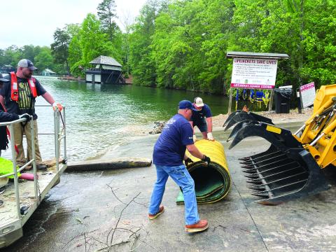Submitted photo. The LBCA holds an annual Cleanup Day every year in May. The organization works with Georgia Power Company and citizen volunteers for a lake-wide cleanup to help remove debris from Lake Burton. 