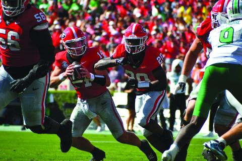 Wesley Branch/The Clayton Tribune. Georgia quarterback Gunner Stockton (14) will lead the Bulldogs against Ole Miss in the College Football Playoffs on Jan. 1 in New Orleans in the Sugar Bowl. Stockton got his first collegiate start in last year’s Sugar Bowl. Stockton has been the starter throughout this season, finishing seventh in the Heisman Trophy voting.