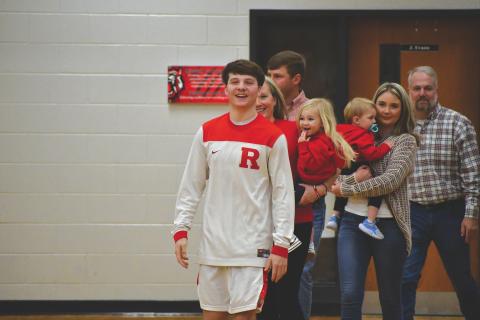 Wesley Branch/The Clayton Tribune. Rabun County senior Huey Blalock is escorted by his family on Senior Night against Towns County. Blalock recently announced his verbal commitment to continue his playing career at the Naval Academy. 