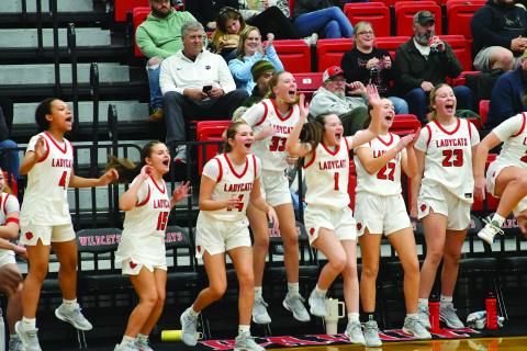 Enoch Autry/The Clayton Tribune. Rabun County Lady Cats celebrate when teammate senior Chloe Shirley scores in the fourth quarter of the girls’ win over East Hall on Dec. 5 at home.