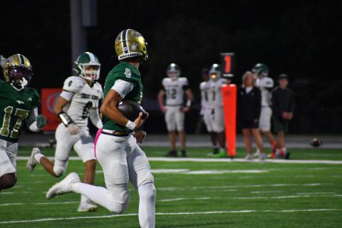 Wesley Branch/The Clayton Tribune. Rabun Gap quarterback Gavin Owens runs into the end zone for a rushing touchdown in Rabun Gap's 42-0 win over Christ School on Oct. 17. Owens officially signed with Memphis University last Wednesday, Dec. 3.
