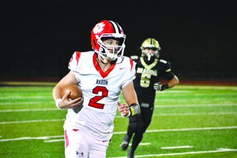 Wesley Branch/The Clayton Tribune. Rabun County senior quarterback Ty Truelove looks downfield on a run versus Pepperell in the state quarterfinals on Nov. 28. Truelove was named first-team All-Region for the third consecutive season this season. Truelove was named the first team All-Region quarterback.