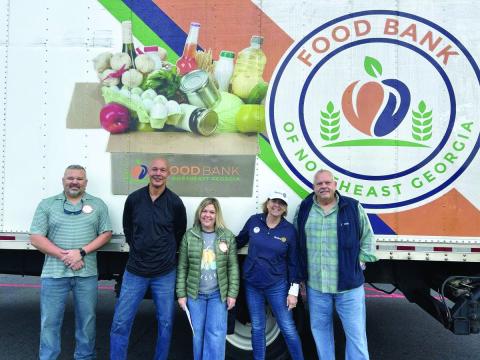Submitted photo. The Rotary Impact Club of Clayton recently organized a food and fund drive for the Food Bank of Northeast Georgia where 4,836 pounds of food and $1,724 in donations were raised. Pictured are Kyle Shook; James Brim, Food Bank of Northeast Georgia Mountain Branch director; Sonya Shook; Amy Hulett; and Jon Tuck, president of the Rotary Impact Club of Clayton.