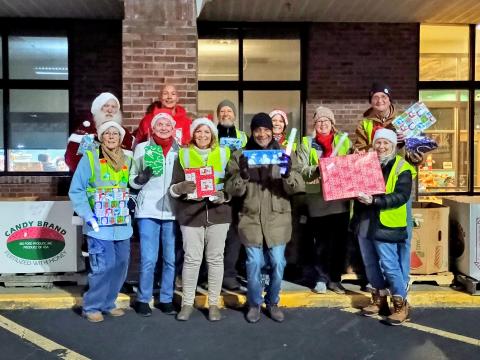 Megan Horn/The Clayton Tribune. Volunteers at the Dec. 16 Food Bank of Northeast Georgia toy drive include James Brim, director of the Food Bank of Northeast Georgia Mountain Branch; Donna Long; Herman Bunn; Renee Ramsay; Stan Vik; Janet Vik; Cherye Weintraub; Stephen Weintraub; Beth Nelson; Mark Shryock; Brenda Cook; and even Santa Claus himself!