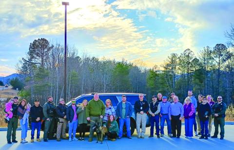 Megan Horn/The Clayton Tribune.  K-9 Handler Michael Shedd and those who worked closely with K-9 “Coss” attended a retirement reception for the working canine held at the Rabun County Sheriff’s Office Dec. 10. That day, K-9 Coss officially retired from active service. 