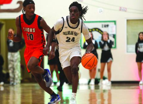 Photo courtesy Audrey Borchers. Brian Neely pushes the ball up the court in TFS’s 75-33 road win over Riverside Military Academy on Jan. 13. The Indians are ranked third.