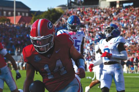 Wesley Branch/The Clayton Tribune. Gunner Stockton celebrates in the end zone after a rushing touchdown in Georgia’s 43-35 win over Ole Miss on Oct. 18. Stockton finished top-10 in Heisman voting as the starting quarterback for the Bulldogs.  