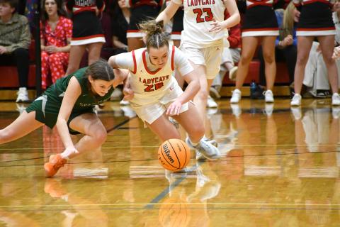 Wesley Branch/The Clayton Tribune. Rabun County’s Millie Southards and Athens Academy’s Millie Pugmire fight for a loose ball on the final possession of Rabun County’s 51-48 win over Athens Academy on Jan 13. Southards knocked the ball free on the last possession, sealing the win for the Lady Wildcats.  