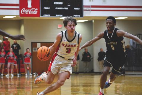 Wesley Branch/The Clayton Tribune. Rabun County senior Huey Blalock drives to the basket in Rabun County’s 71-48 win against Elbert County on Jan. 20. Blalock posted a triple-double in the win. Navy-commit Blalock finished the night with 10 points, 15 assists, 10 rebounds and three steals.