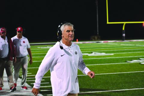 Wesley Branch/The Clayton Tribune. Rabun County defensive coordinator Bill Stewart eyes the camera during Rabun County’s season-opening 42-6 win over White County on Aug. 15, 2025. Stewart was reportedly in consideration for the Rome head coaching job, which was expected to be voted upon on Jan. 20 at a Rome City Schools Board of Education meeting. 