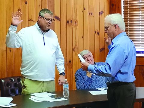 Megan Horn/The Clayton Tribune. Incumbent City of Dillard Mayor Claude Dillard, left, is sworn-in for another term in office by City Attorney Jay Doss to start the Tuesday, Jan. 13, meeting. Doss also was re-appointed as the city’s attorney. 