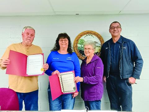 Megan Horn/The Clayton Tribune. The City of Mountain City council includes Bill Fountain, left; Brenda Hooper; Mayor Grace Watts; Michael Holt and Eric McCrackin (not pictured). Fountain and Hooper hold up official documents from Tammy Whitmire, director of elections, certifying their wins in the Nov. 4, 2025, General Election. Fountain was elected to the Post 3 Council Member seat while Hooper was re-elected to the Post 2 Council Member seat after running unopposed. 