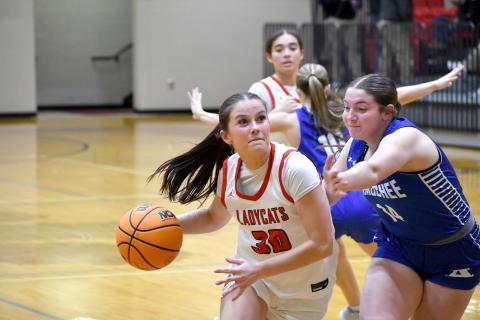 Wesley Branch/The Clayton Tribune. Rabun County senior Madison Houck drives to the basket in Rabun County’s 63-42 first round playoff win over Armuchee on Feb. 24. Houck finished the win with 12 points and 10 rebounds.